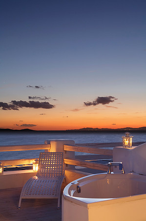 Terrace in a Junior Suite with outdoor Jacuzzi at the Mykonian Mare Resort